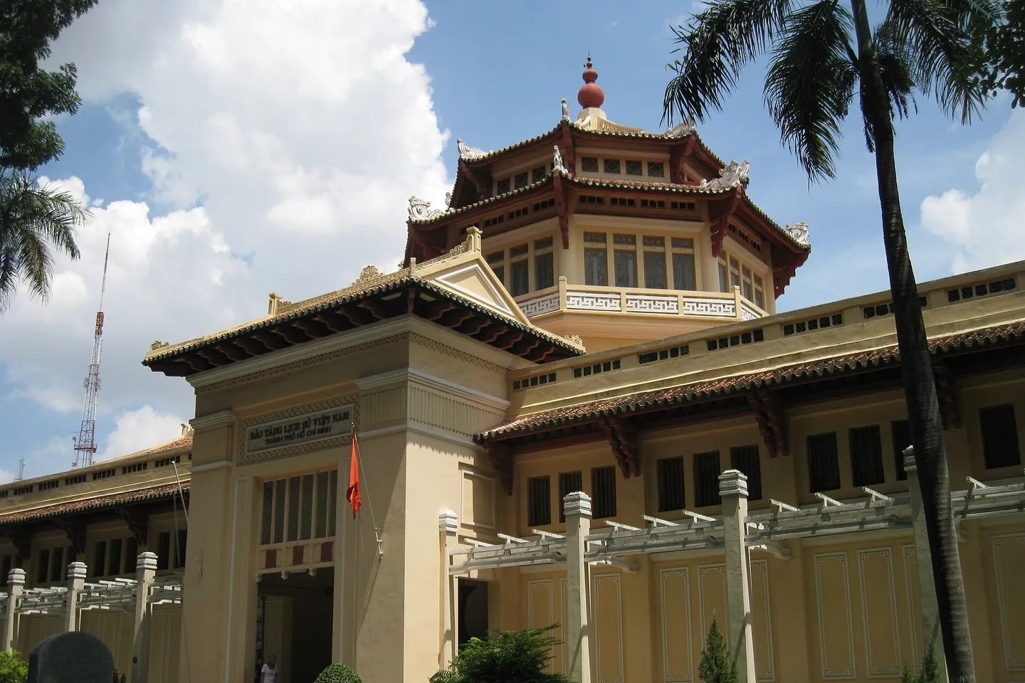 The yellow History Museum building with its pagoda-style tower roof