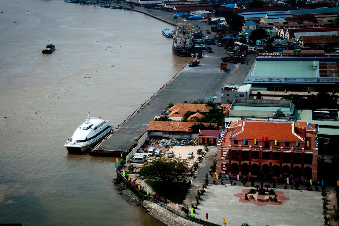An aerial view of the red-roofed Nhà Rồng building on the Saigon River wharf