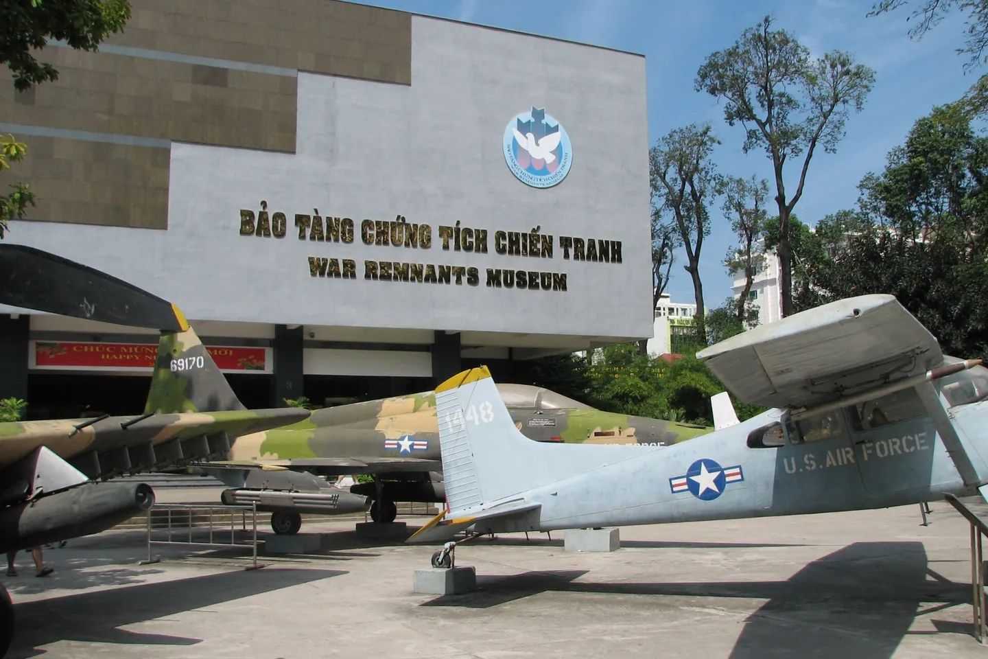 The War Remnants Museum building with US military planes parked in the yard in front