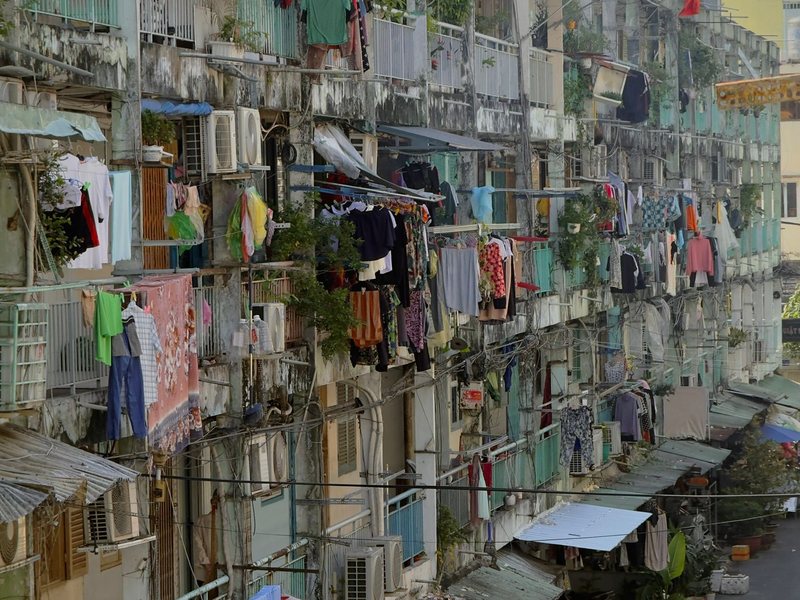 Laundry hanging from row after row of balconies on the Nguyen Thien Thuat apartment blocks